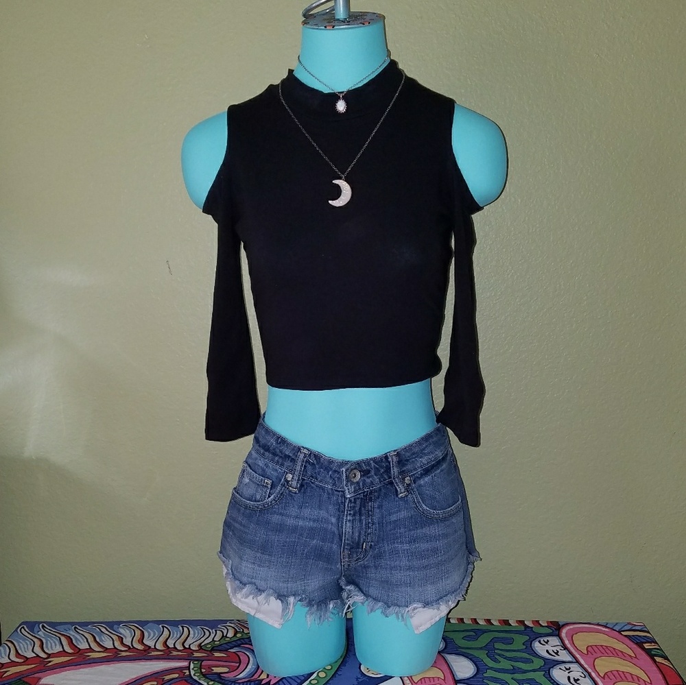 Black half-sleeve crop top with shoulder cut-outs.